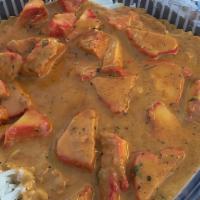 Chicken Tikka Masala/ Butter Chicken  · Boneless chicken marinated in ginger-garlic sauce, baked in the Indian clay oven (tandoor), ...