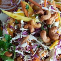 Chicken Mango Salad* · Gluten free. Shredded chicken breast, mango, cabbage, carrots, cilantro, basil, and cashew n...
