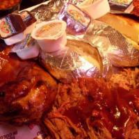 The Feast · The Feast includes Baby Back Ribs, BBQ Chicken, Pulled Pork, Beef Brisket, Garlic Toast, Pot...