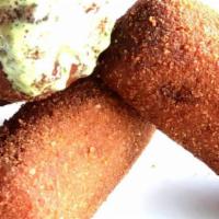 Croquetas De Jamon · Breaded and fried freshly minced for a creamy texture ham, served with Cilantro Aioli.