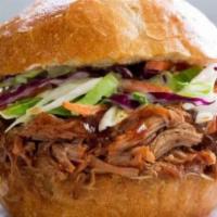 The Porker · Pulled pork, coleslaw, grilled bell peppers, red, & onion topped w/ BBQ sauce.
