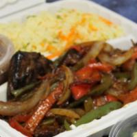 #24. Bistec Encebollado · Thin-out seasoned marinated in vinegar and spices, pan fried to perfection and topped with s...