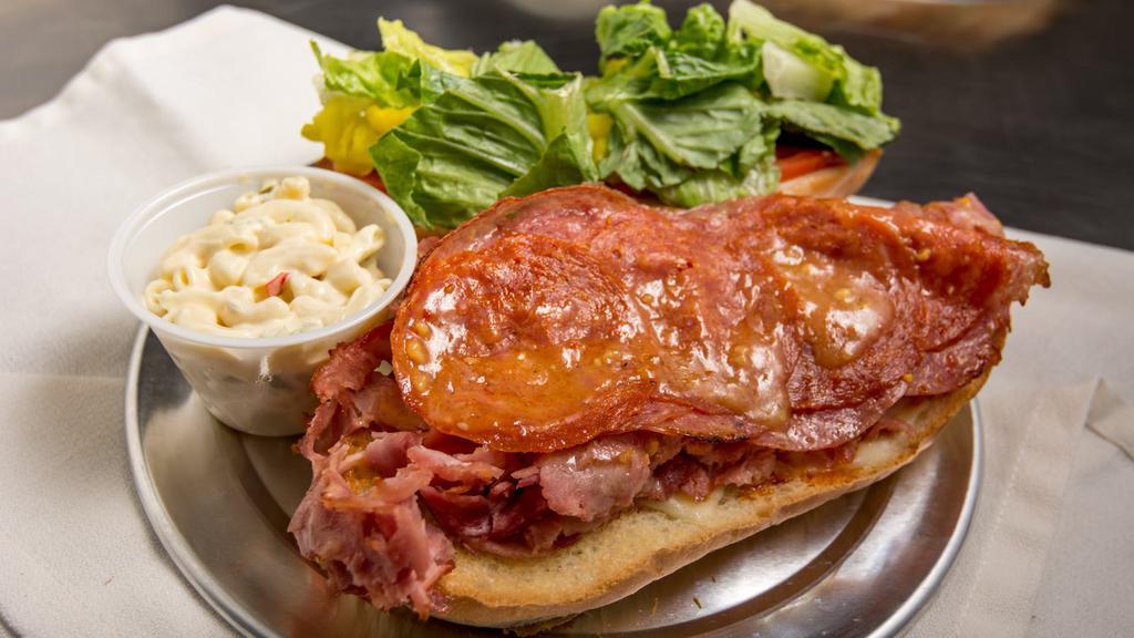 The Italian Sandwich · Salami, pepperoni ham, Italian dressing & provolone. Lunch size sandwich is a half sized sandwich.