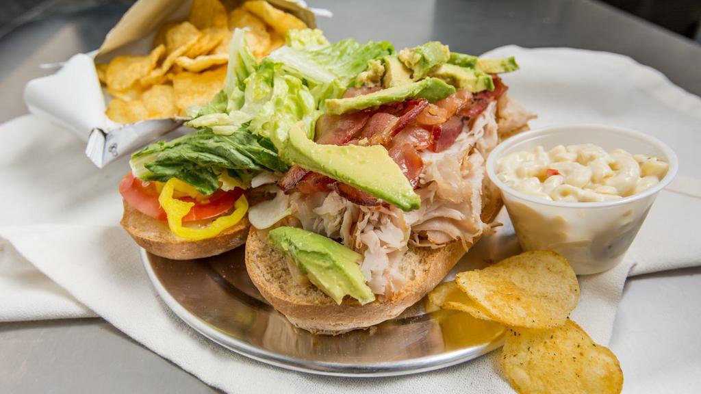Starvin Marvin Sandwich · Turkey, bacon, avocado & Swiss. Lunch size sandwich is a half sized sandwich.
