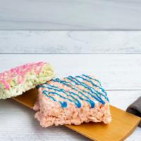 Lolo'S Swirl Treat · A cotton candy flavored rice krispie treat glazed with pink or blue cookie icing, yum!