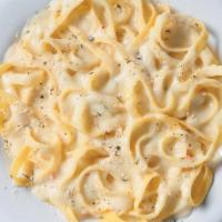 Small Fettuccine Alfredo · Fettuccine topped creamy garlic and parmesan Alfredo sauce topped with shaved Parmesan chees...