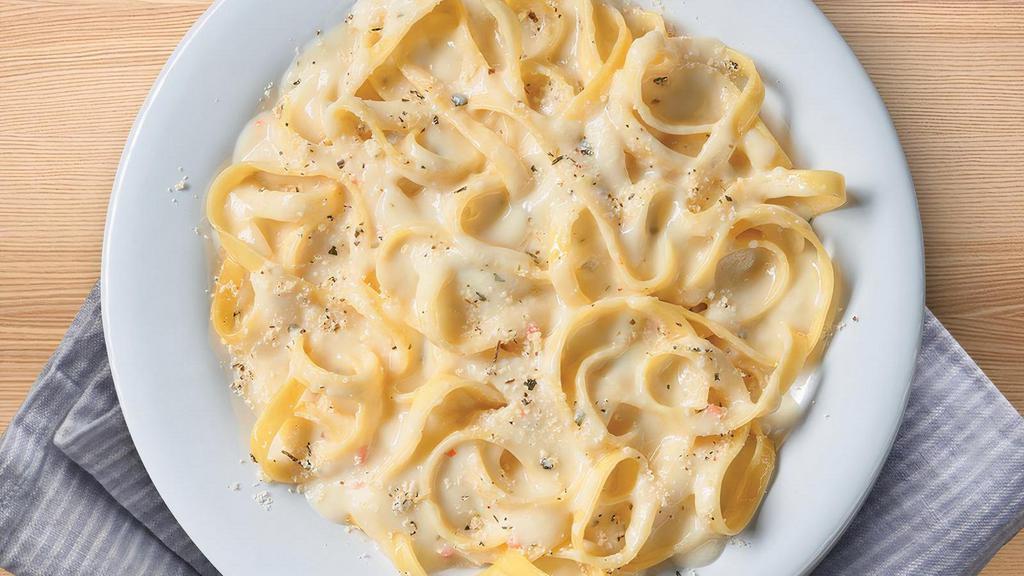 Small Fettuccine Alfredo · Fettuccine topped creamy garlic and parmesan Alfredo sauce topped with shaved Parmesan cheese and Italian herbs.. Includes 2 of our Signature Garlic Breadsticks