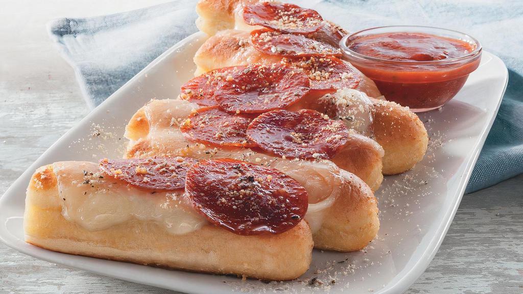 Pepperoni Pizza Breadsticks · This shareable item takes our signature garlic breadsticks to the next level! Enjoy our breadsticks topped with Mozzarella cheese & pepperoni. Served with Marinara for dipping.