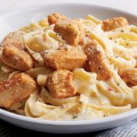 Chicken Fettuccine Alfredo · Fettuccine topped with creamy garlic and. parmesan Alfredo sauce topped with shaved Parmesan...