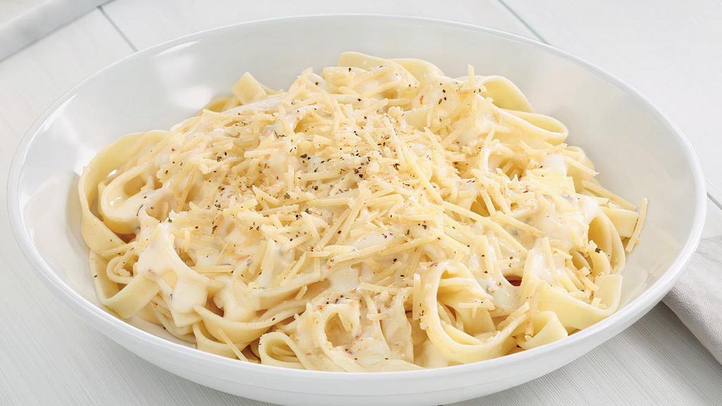 Fettuccine With Alfredo · Fettuccine topped creamy garlic and parmesan Alfredo sauce topped with shaved Parmesan cheese and Italian herbs.. Includes 2 of our Signature Garlic Breadsticks