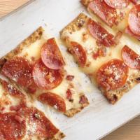Low Carb Pepperoni & Bacon Flatbread · A low carb flatbread topped with garlic butter, mozzarella, pepperoni, and bacon.  (8 grams ...