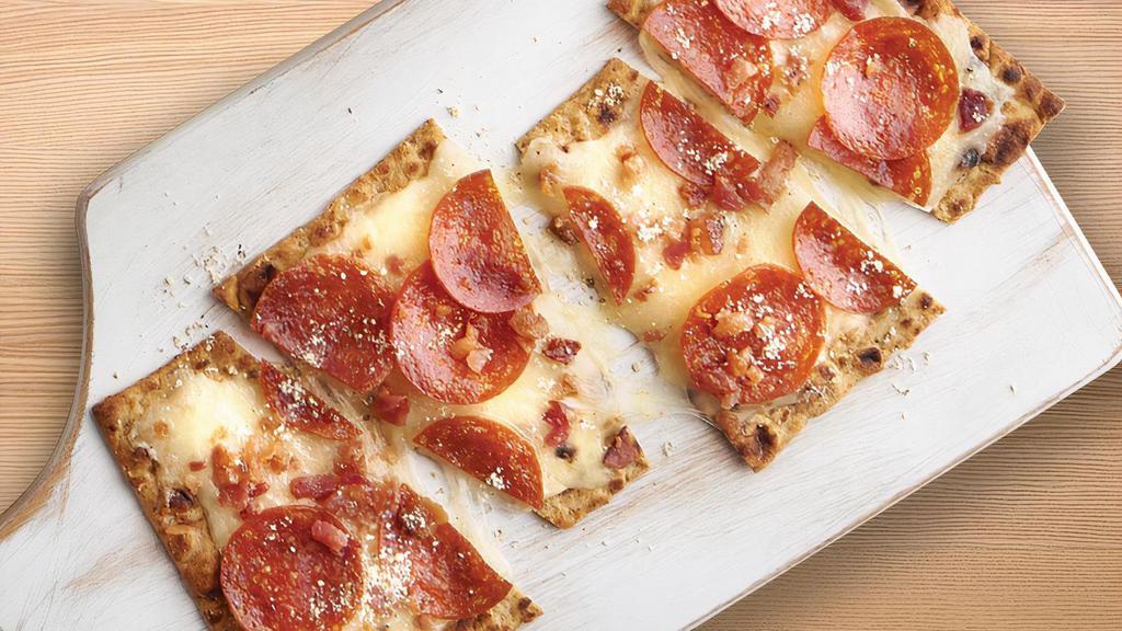Low Carb Pepperoni & Bacon Flatbread · A low carb flatbread topped with garlic butter, mozzarella, pepperoni, and bacon.  (8 grams of net carbs).