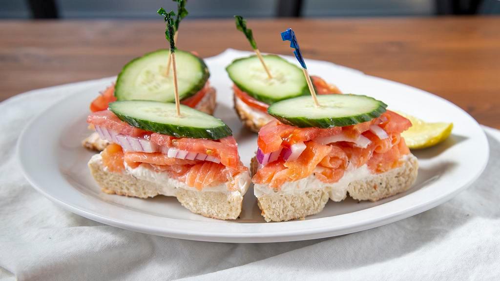 Bagel W/ Lox · with tomato & onion. Capers add .50  Open-face with double the goodies! add 3.99