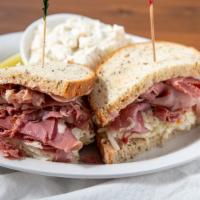 New Yorker Sand · Corned beef or pastrami, swiss, coleslaw &  russian on rye.