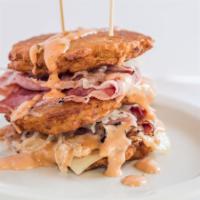 Nybb Pile Up · Three of our famous potato pancakes piled high with corned beef, pastrami, kraut, swiss and ...
