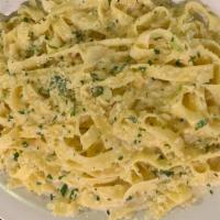 Fettuccini Alfredo · Our own Alfredo sauce made with a blend of
imported Italian cheeses