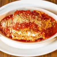 Lasagna · Layers of Ricotta cheese, Provolone cheese, ground
homemade meatballs and Italian sausage