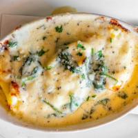 Stuffed Shells With Spinach Cream Sauce · Three jumbo pasta shells stuffed with Ricotta cheese and baked in our spinach cream sauce.