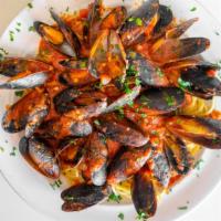 Mussels Del Diavolo · Mussels in the shell, steamed in a spicy red sauce, fresh garlic, chopped Roma Tomatoes and ...