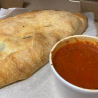 Small Cheese Calzone · Pizza crust folded and stuffed with Ricotta and Provolone cheese.
Served with Romano’s sauce...
