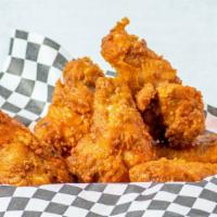 Chicken Wings (6 Pieces) · 6 pieces of chicken wings with a side sauce.