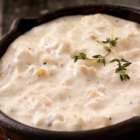 Bowl Of Clam Chowder · New England Style Clam Chowder with Clams, Bacon, Potato in a Creamy Broth
