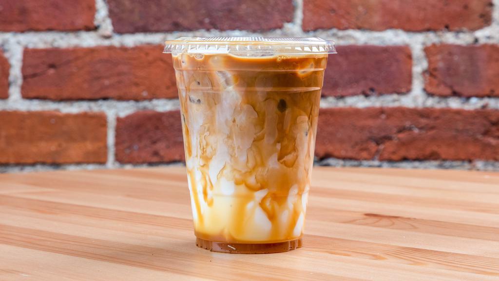 Dulce De Leche · House-made caramel sauce mixed together with our brewed coffee and steamed milk. Topped with whip cream and caramel drizzle.