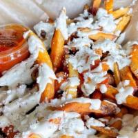 Garlic Fries · 1 lb. of golden hand-cut russets smothered in garlic herb aioli and sheep-milk feta.