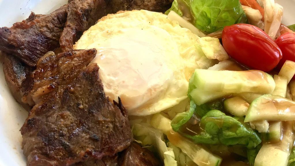Beef Short Ribs Rice Bowl · Boneless beef short ribs, fried egg serve with white rice and house salad with sesame ginger dressing.