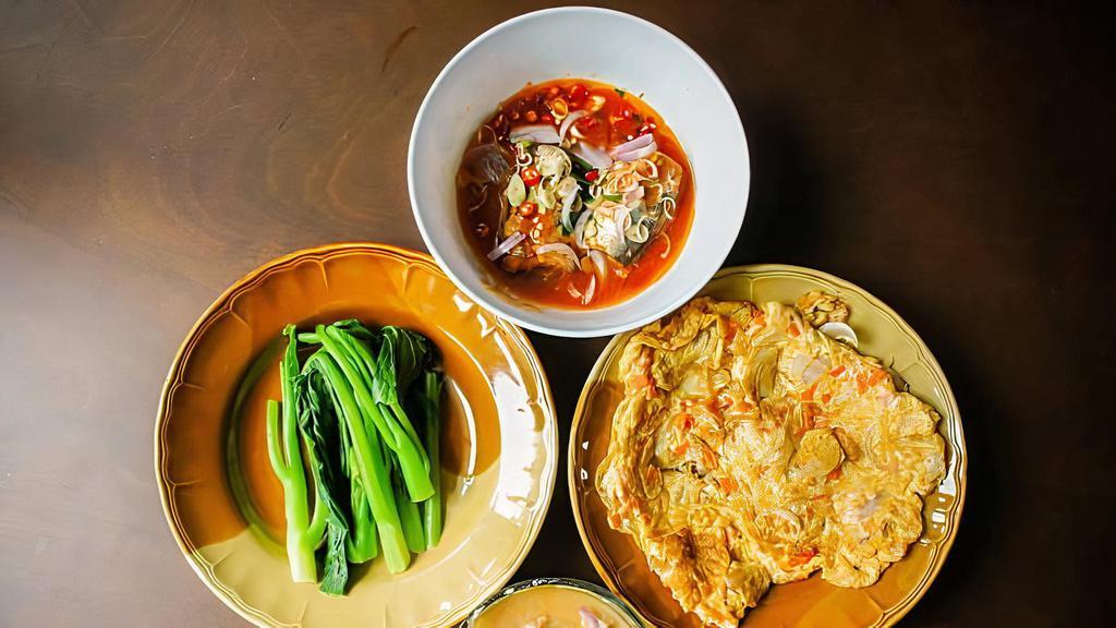Panang Curry Tofu (R7) · Vegan, gluten free. Medium spiced vegan red coconut curry, sweet potatoes, carrots, Thai basil and black pepper.