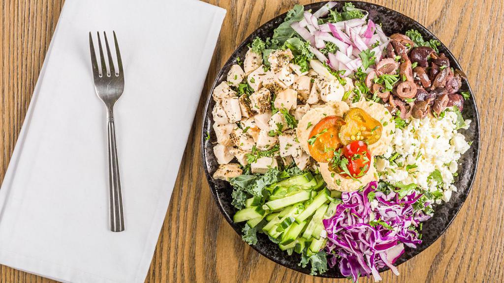 Spicy Greek Salad · Grilled chicken breast, romaine, kale, cabbage, black lentils, feta, kalamata olives, spicy pickled peppers, cucumber, red onion, + dijon-balsamic vinaigrette