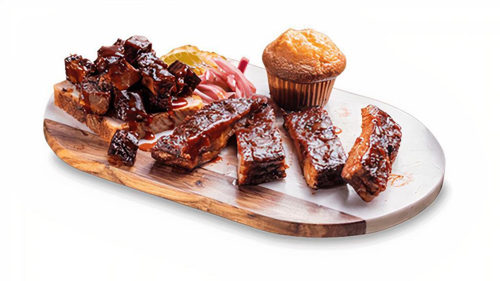 Burnt Ends-N-Ribs Combo · Burnt Ends paired with a 1/3 slab of St. Louis-Style Spareribs. Served with choice of two sides and a Corn Bread Muffin.