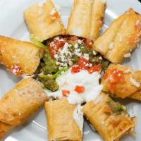 Chicken Taquitos · Top menu item. Flour tortillas stuffed with chicken and Monterrey Jack cheese rolled and fri...