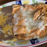 Enchiladas Chipotle · 2 enchiladas stuffed with chunks of chicken breast in a delicious creamy chipotle sauce. Ser...