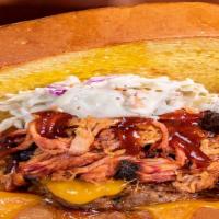 #19 Texas · Half Pound Burger, Pulled Pork, Coleslaw, Choice of BBQ Sauce, Choice of Cheese, Grilled Oni...