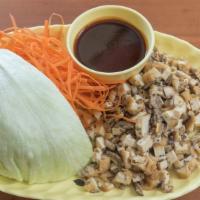 Chicken Lettuce Wraps · Minced chicken sautéed with ginger, straw mushroom; to be wrapped with crisp lettuce wedge, ...