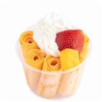 Mango Tango · Mango sorbet, lemon sorbet, mangoes, strawberries, pineapple, coconut shavings.