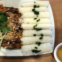 1 Steamed Rice With Grilled Pork / Cơm Thịt Nướng · Steam rice serves with grilled pork, cucumber, pickle, shredded lettuce