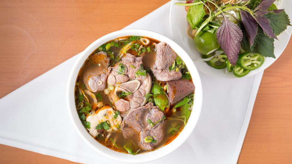 1  Spicy Beef Noodle Soup / Bún Bò Huế Đông Ba · Vermicelli with beef, pork, pork roll.