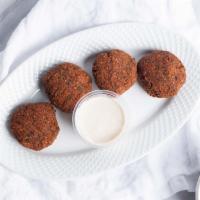 Falafel · 4 piece of fried falafel balls served with our homemade hummus.