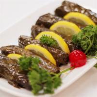 Sarma · Grape leaves stuffed with rice, onion, garlic, pasley dill, mint and olive oil.