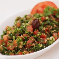 Tabbouleh · Chopped pasley, tomato, mint, green onion, olive oil, bulghur and lemon juice.