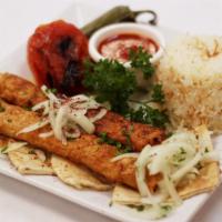 Chicken Adana Kebab · Maza style seasoned ground chicken grilled on the skewer.
