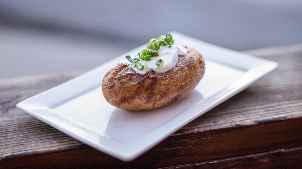 Baked Potato · baked russet potato topped with butter, sour cream, chives