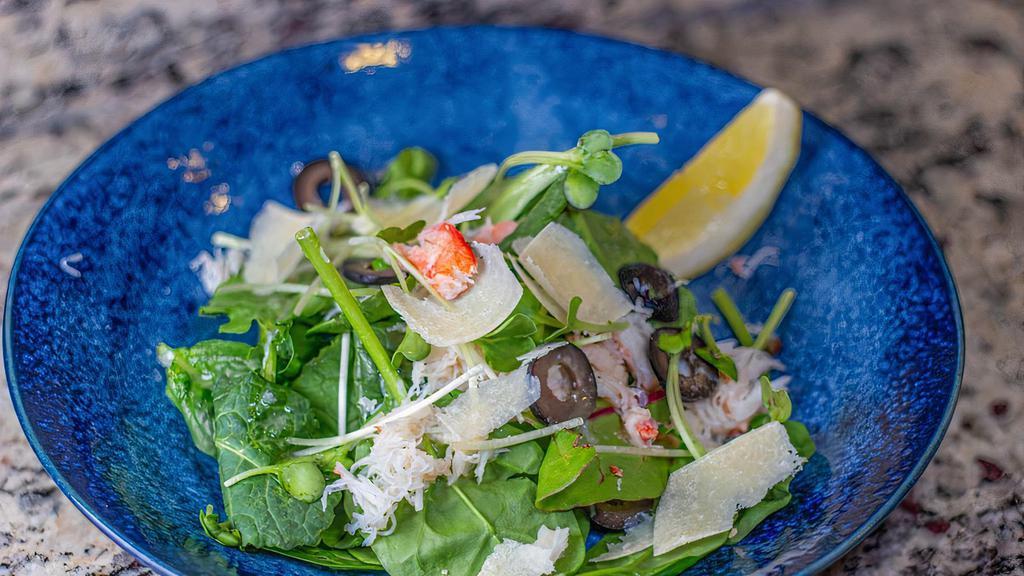 Snow Crabmeat Salad · Fresh spring mix topped with snow crab, radish sprouts, Parmesan cheese and French dressing.