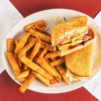 Chicken Club · Grilled Chicken Breast, Bacon, Tomato, Lettuce, and Fried Egg.