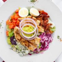 Cobb Salad · With grilled chicken, crisp bacon, crumbled bleu cheese, tomato, hard boiled egg and guacamo...