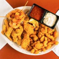 Seafood Combo Plate · 6 Bacon Wrapped Prawns, 4 coconut prawns, calamari & popcorn shrimp. Served with sweet chili...