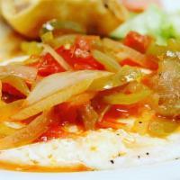 Huevos Rancheros · Two eggs any style served upon tostada topped with ranchera sauce.