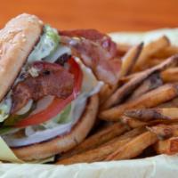California Burger · 1/4 lb beef patty topped with avocado, two strips of bacon, and a cheese of your choice! Mad...